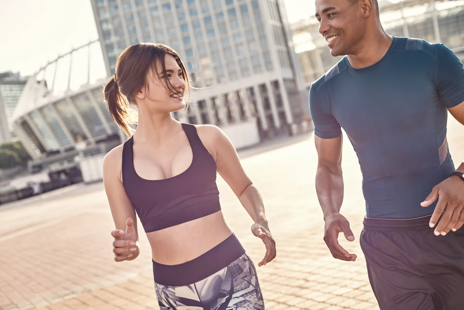 fitness couple enjoying a morning jog in city utc